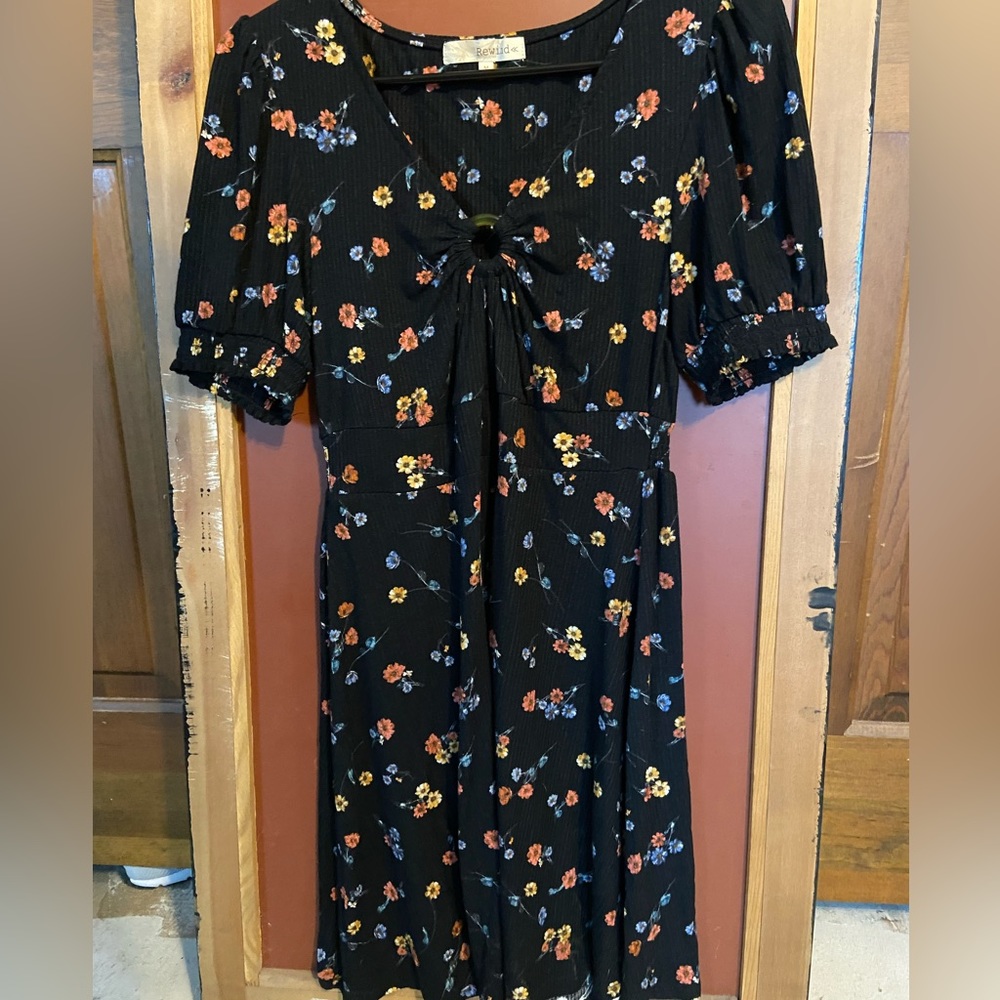 Brand new, never worn medium black dress with flower pattern
